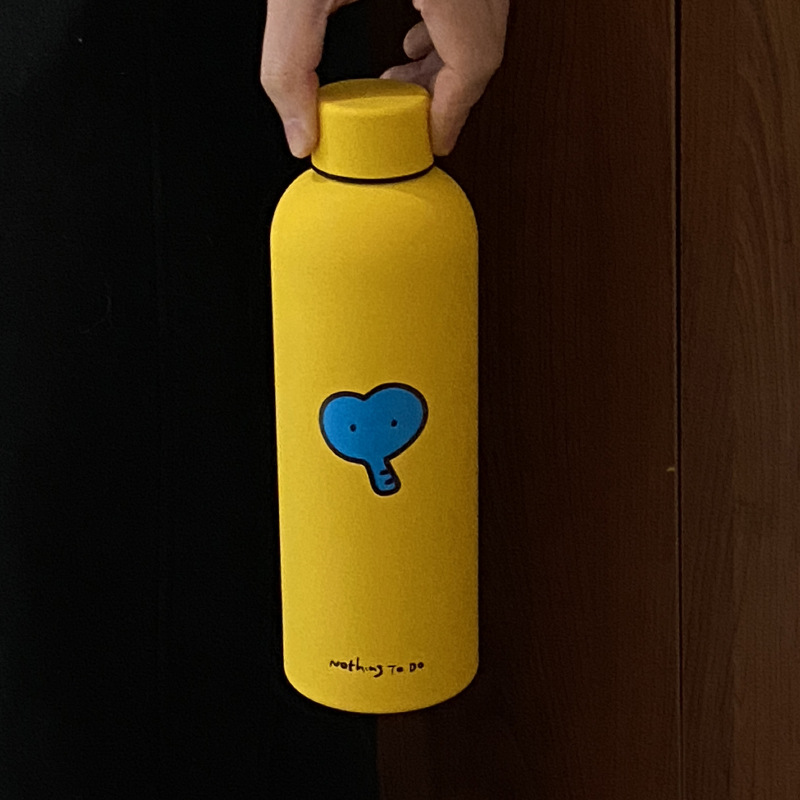A small yellow heart-shaped elephant insulated cup, a large-capacity, high-quality stainless steel water cup, a cute travel cup, 500ml details Picture
