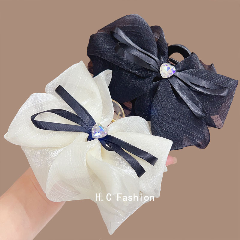 A new Korean-style black and white bow clip for women's large-sized hair clip with a fashionable and high-end look at the back of the head details Picture