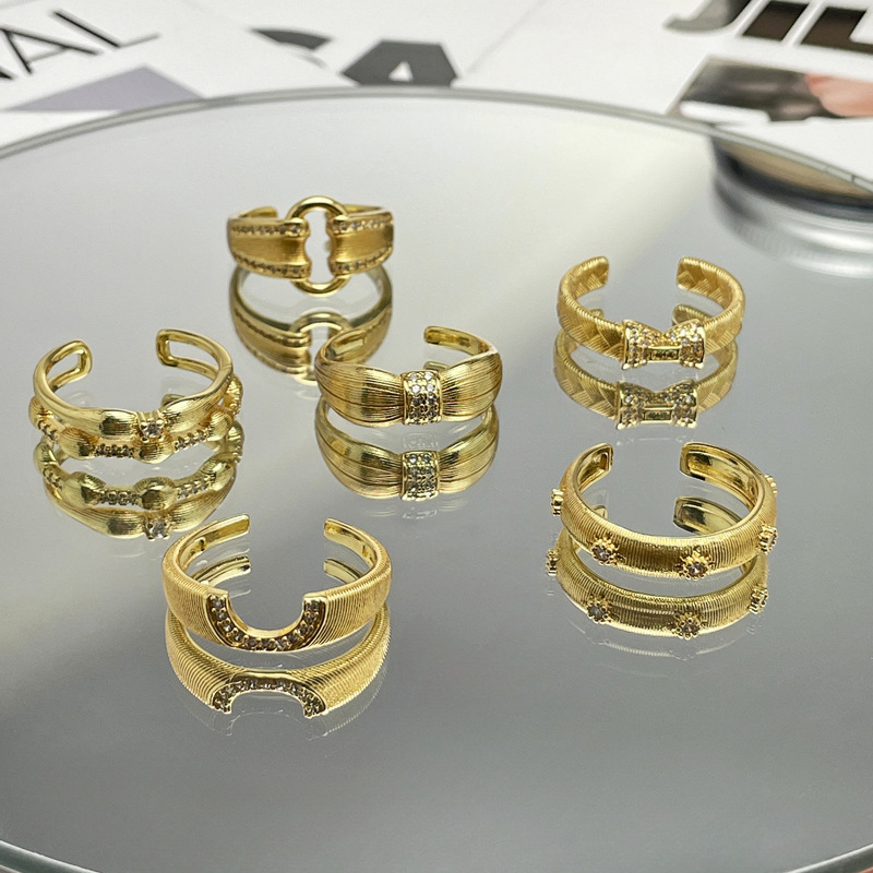 A unique, exquisite and light luxury ring with a unique design of a women's niche market featuring golden wheat ear weaving and brushed geometric openings details Picture