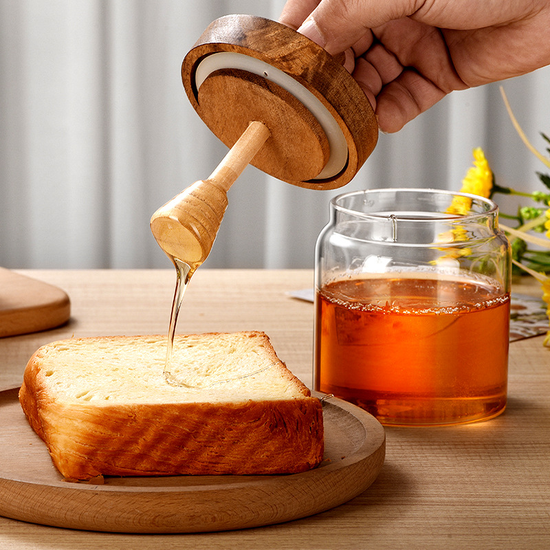 Honey storage bottle, high borosilicate glass sealed jar, wooden cap, stirring rod, transparent bottle, kitchen storage jar Application Scenario