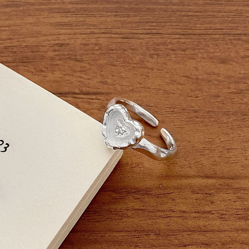 Textured lava heart ring, an irregular heart-shaped, niche design for women, in an Instagram style, with a cold and individualistic vibe, is a popular ring on the Internet Application Scenario