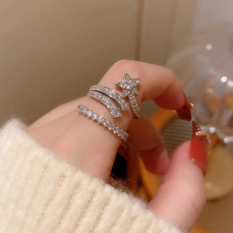 This light luxury and high-end full-diamond zircon star opening ring is worn by a woman in layers, exuding a sweet and cool temperament and a unique texture. It's a trendy index finger ring full figure
