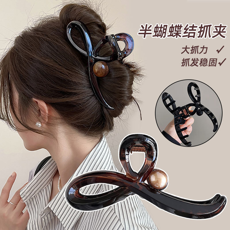 Korean spring and summer grabber with a high-end feel, large hair volume, half-tied hair at the back of the head, shark clip headwear full figure