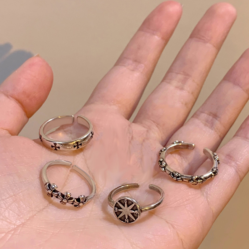 A simple, dark, aged cross-shaped open ring for women, a trendy and unique European and American fashion design details Picture