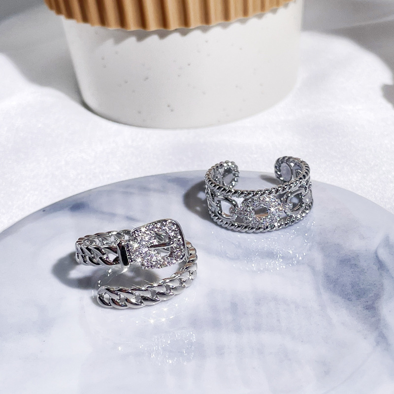 This is a fashionable and versatile index finger ring with a unique design for women, featuring a double-layer belt buckle and zircon chain opening full figure