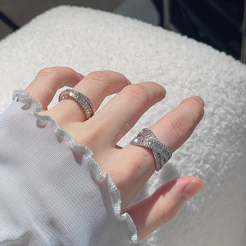 A high-end, light luxury, versatile full-diamond open ring for women on Instagram, with a cold style and geometric cross-layered design. It's a delicate food ring details Picture