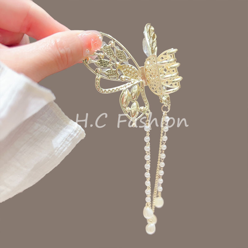 The new crystal butterfly pearl tassel gripper is a high-end and elegant semi-tied hair accessory for the back of the head, featuring a shark clip details Picture