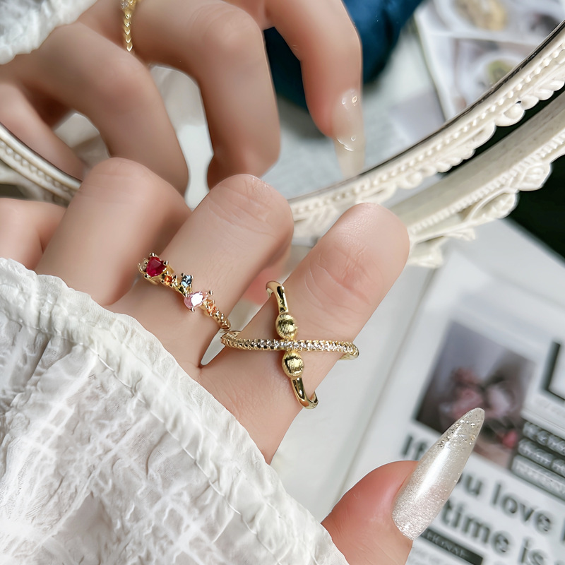 The golden circular line diamond planet brushed ring is a unique and creative design for women with colorful diamonds. It is a fashionable and personalized ring trend full figure