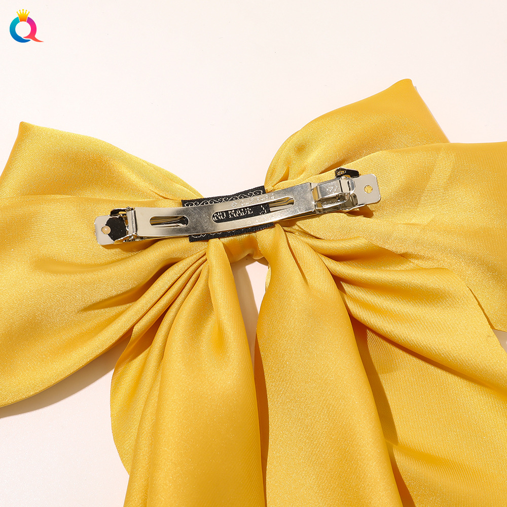 The new cross-border bow ribbon hair clip from Qiyue Korean Edition is a simple and elegant silk silk spring clip hair accessory at the back of the head Application Scenario