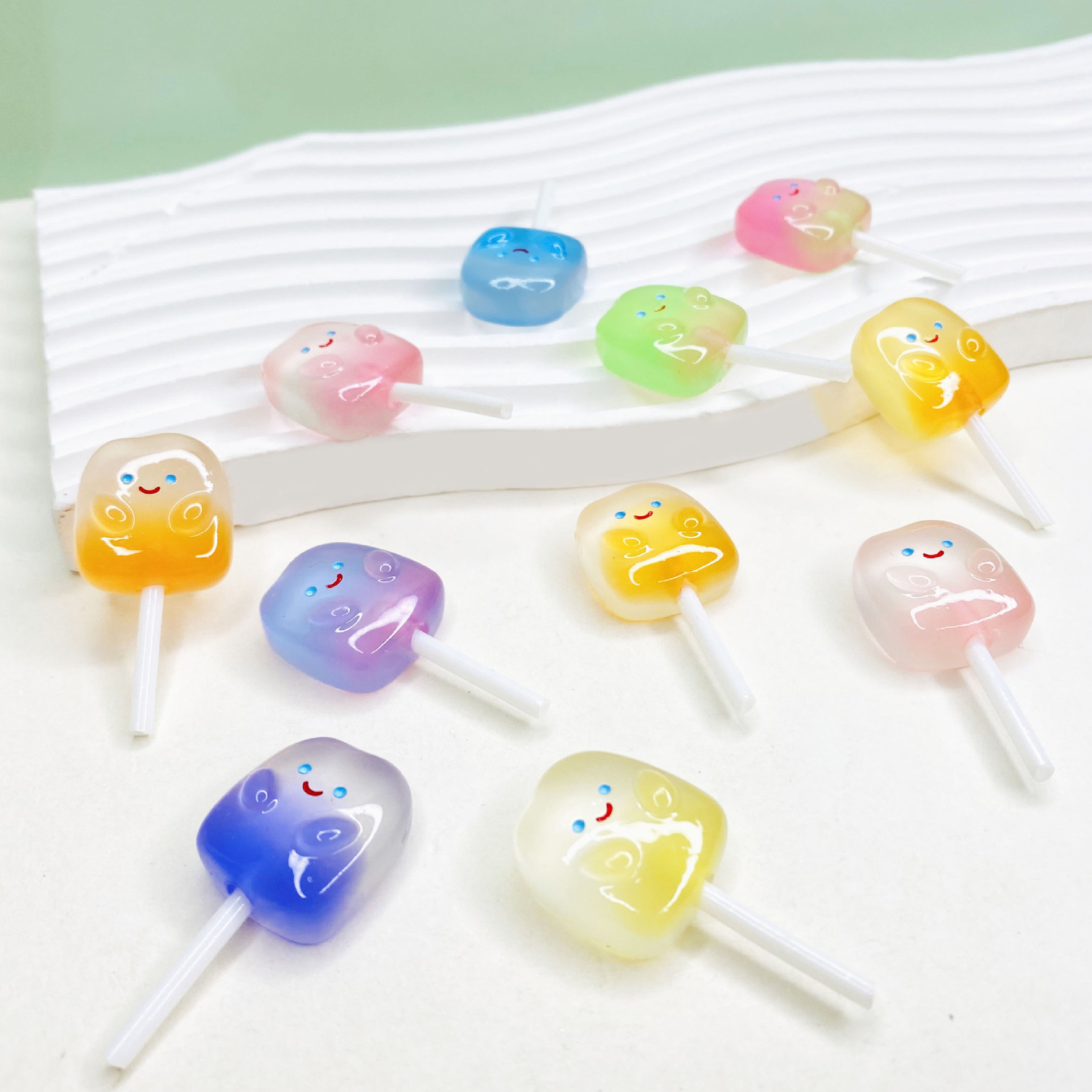 Wholesale of simulated lollipops, colorful smiling faces, luminous resin food and toy accessories, DIY handmade jewelry and accessory materials full figure