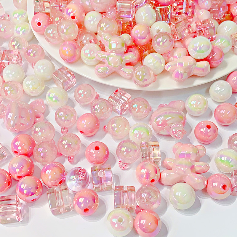 Wholesale of diy accessories such as beaded and scattered acrylic pink series luminous bear rabbit bracelets and mobile phone chains full figure