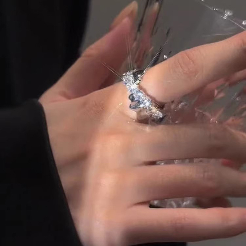 A high-end zircon cross ring for women's ins, with a cold, light luxury and niche design. It's a simple and elegant index finger ring Application Scenario