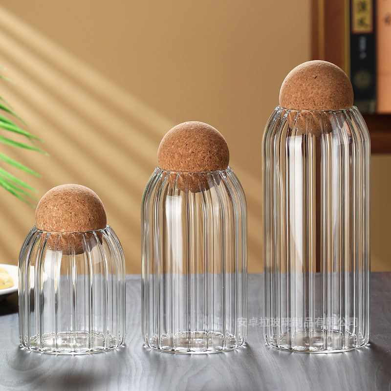 The manufacturer supplies striped glass storage jars, round wooden stopper jars, flower tea sealed jars, candy jars and coffee bean storage boxes Application Scenario