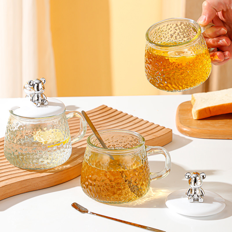 Little bear hammer-patterned glass cup, home water cup, cute and creative cup lid with handle, printed logo coffee cup Application Scenario