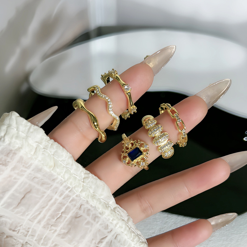 A trendy, slightly inlaid blue diamond lace open ring in the style of ancient Chinese coins, a simple and individual cold style index finger ring for women details Picture