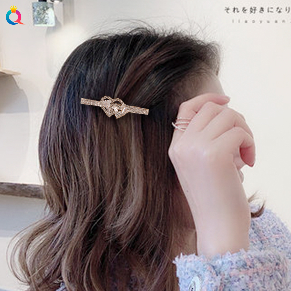 The Qiyue y2k hair clip features a Korean-style water diamond clip, a light luxury heart-shaped bangs clip, and a feminine and high-end look details Picture