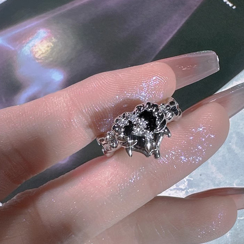 The black heart-shaped open ring set with zircon has an asymmetrical design and texture, presenting a cool and trendy dark style for both men and women details Picture
