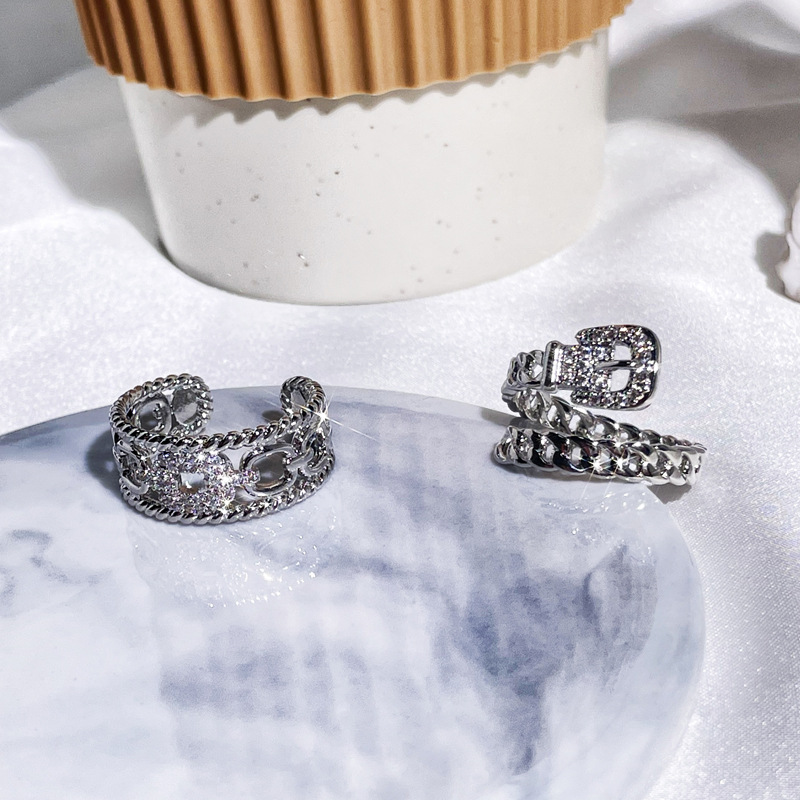 This is a fashionable and versatile index finger ring with a unique design for women, featuring a double-layer belt buckle and zircon chain opening details Picture