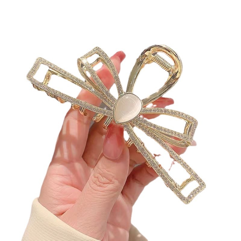 French large back head bun hair clip, sweet and elegant bow, cat's eye stone water diamond hair clip, female shark clip Item Picture