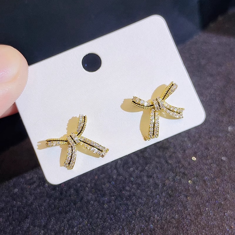 Xuhui brand exquisite and light luxury copper plated with real gold and set with zircon 925 silver needle bow, lacquered, fashionable and elegant stud earrings Item Picture