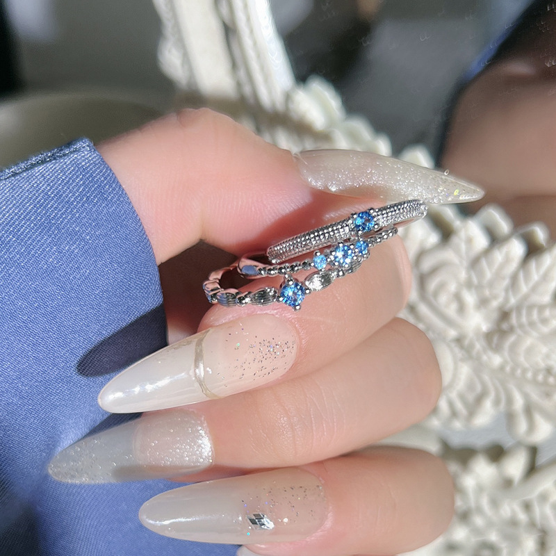This is a popular and trendy light luxury blue diamond ring with a fine loop for layering, exuding a sense of sophistication. It's a simple, individual and exquisite ring for women details Picture