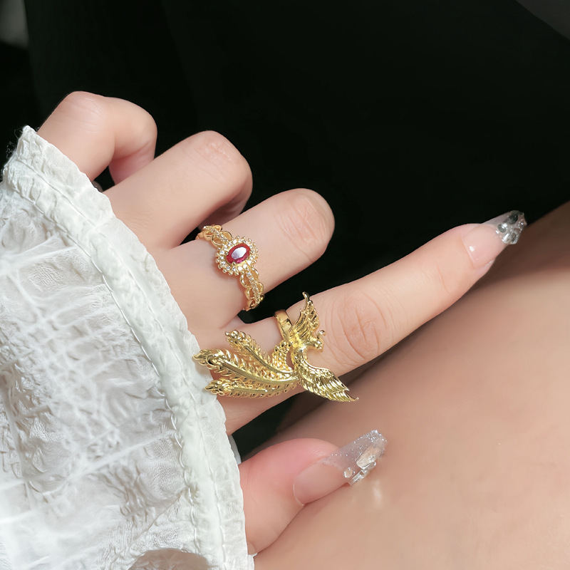 A retro golden phoenix ring in court style, a fashionable, light luxury and elegant Hanfu accessory, a new Chinese-style food ring full figure