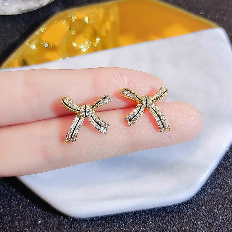 Xuhui brand exquisite and light luxury copper plated with real gold and set with zircon 925 silver needle bow, lacquered, fashionable and elegant stud earrings details Picture