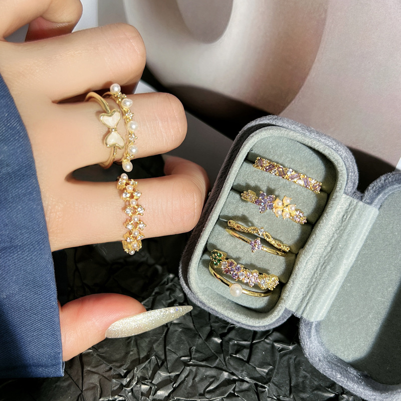 Korean-style light luxury small diamond pearl inlaid elegant ring, women's bow, niche design, sweet and cool, versatile ring full figure
