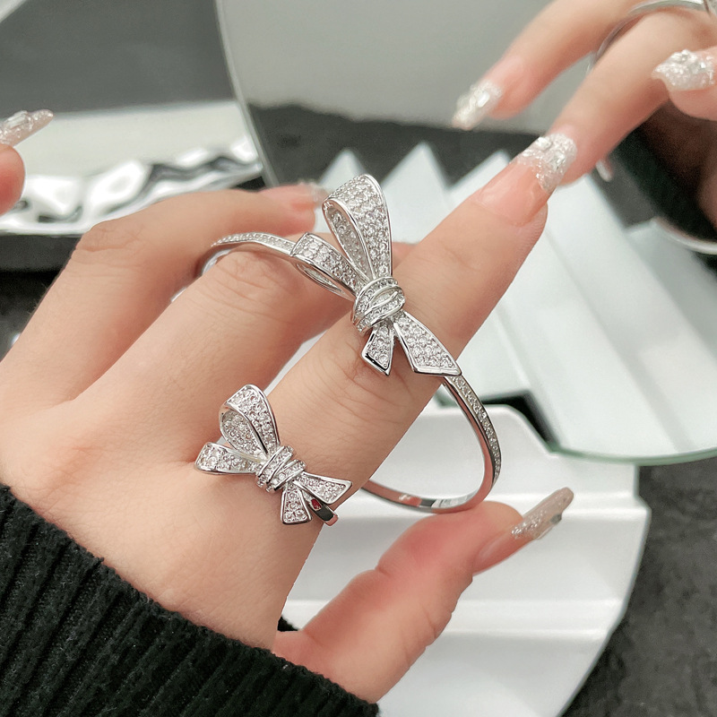 A new trendy micro-inlaid zircon bow ring bracelet set for women, featuring a simple and individual Korean style with a niche design full figure