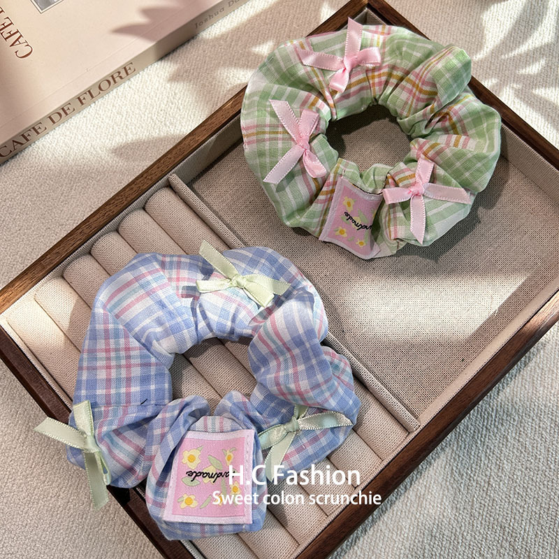 Summer Internet celebrity gentle Korean-style bow fabric large intestine circle check pattern elegant female hair band, ponytail hair tie hair accessory Application Scenario