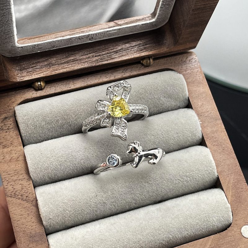 A light luxury and high-end bow yellow diamond open ring for women on Instagram, with a cold and elegant style, exquisite and versatile ring accessory full figure