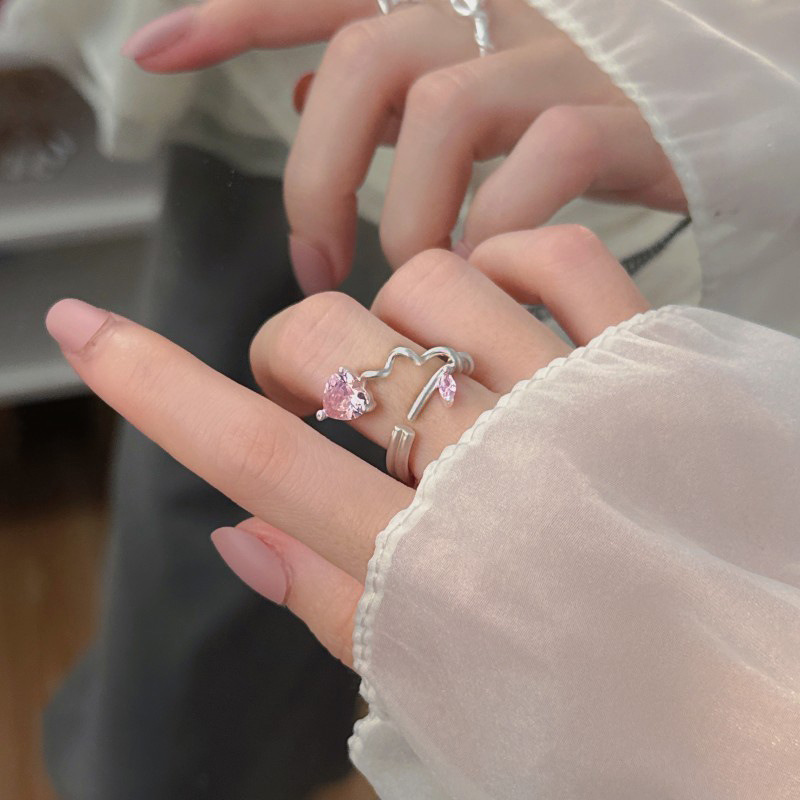 A new open ring with a sweet and cool style, a niche design, and a light luxury and high-end feel. It's a pink diamond zircon ins cold style ring for women full figure
