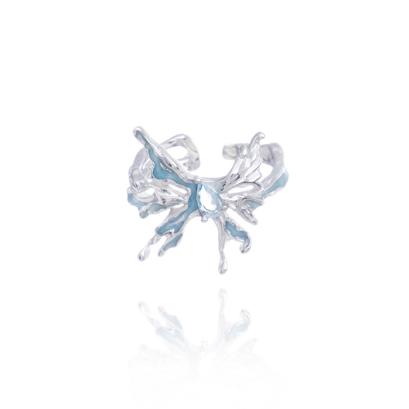 A niche design of an ice blue resin butterfly-shaped opening ring for women with an irregular texture on Instagram. A cold style food ring trend Item Picture