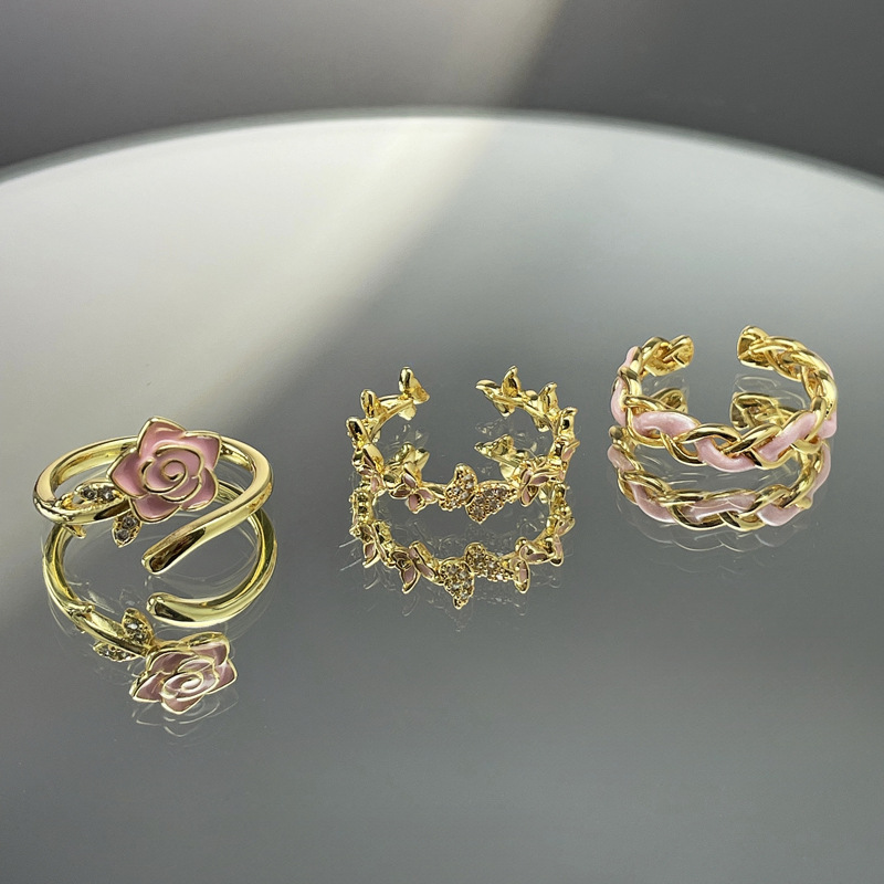 A high-end, sweet and cool pink glazed flower butterfly woven open ring, a light luxury, fashionable and versatile ring for women to wear in layers full figure
