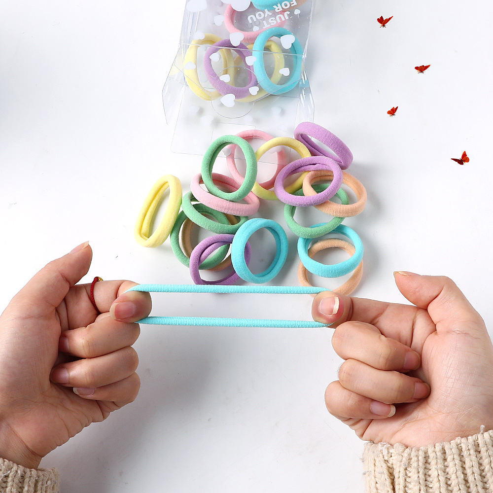 Factory wholesale candy-colored towel loops, heart-shaped boxes, basic hair bands, simple and seamless towel loops and hair ties Application Scenario
