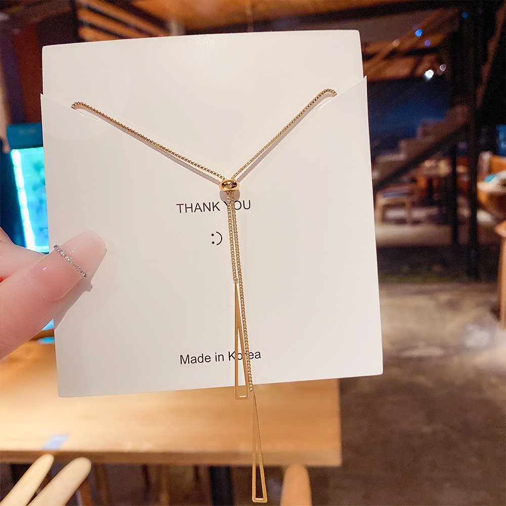 A pull-out geometric tassel titanium steel necklace with a light luxury and niche design sense, a new trendy accessory for 2025 full figure