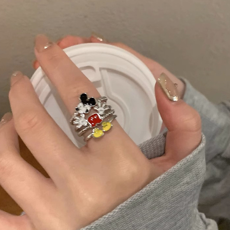 A cute Mickey Mouse ring with a childlike cartoon style. A girl student's personality is mischievous. A couple's best friend index finger ring Application Scenario