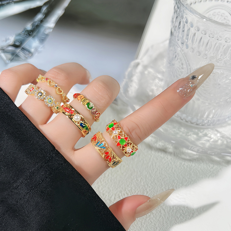 The antique Chinese trend style enamel hollowed-out fashionable geometric eye ring is adjustable, exuding a sense of high-end simplicity and versatility. It's a trendy ring details Picture
