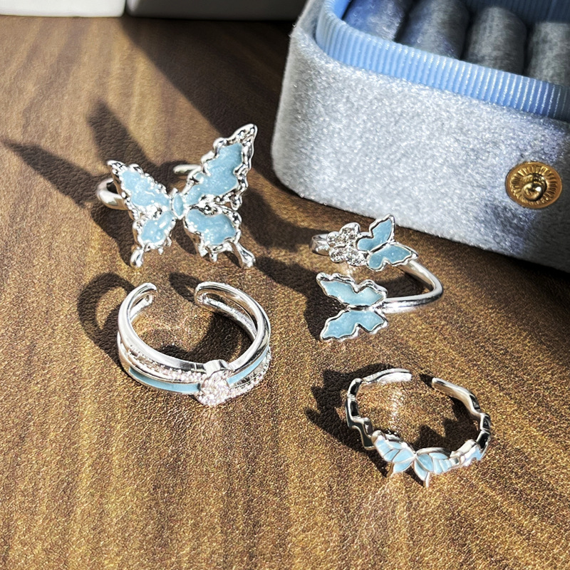 The new silver-white-blue gilded enamel liquid butterfly opening ring for women features a simple and niche design with a light luxury feel Application Scenario