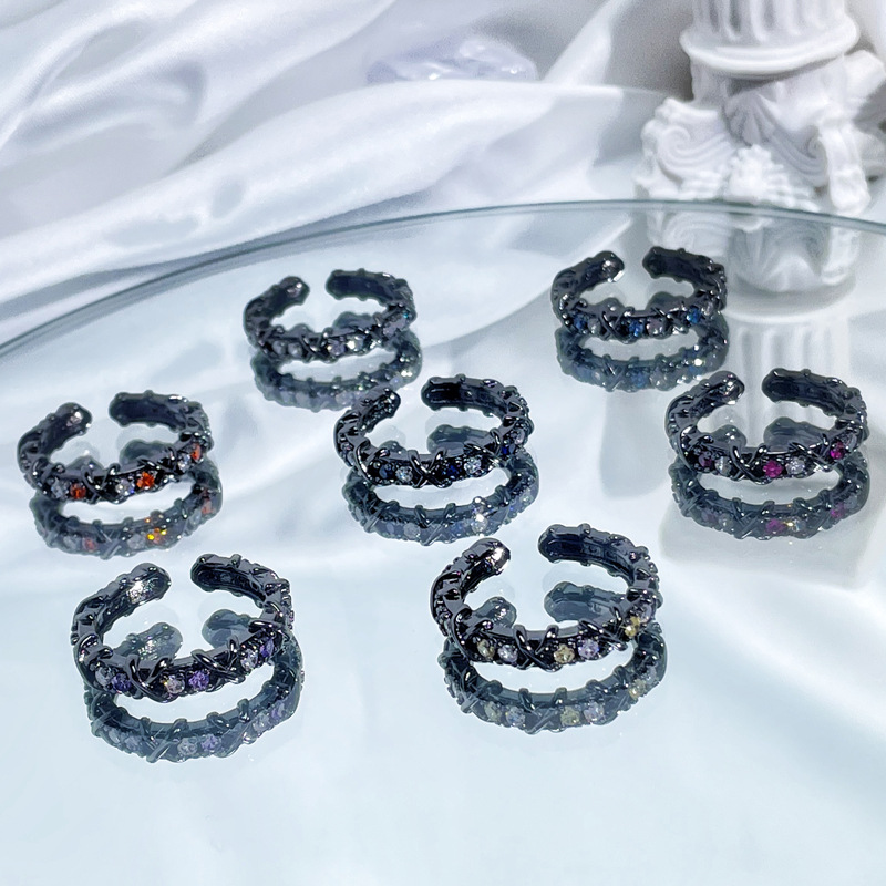 This dark cross-colored zircon open-top ring from Europe and America features a unique design for women, exuding a sense of light luxury and simplicity. It's a trendy index finger ring full figure