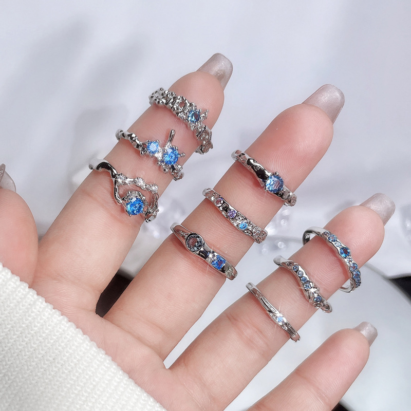 A light luxury and high-end sea-blue zircon open ring for women on Instagram, with a cold style, sweet and cool, irregular texture, and a trendy index finger ring details Picture