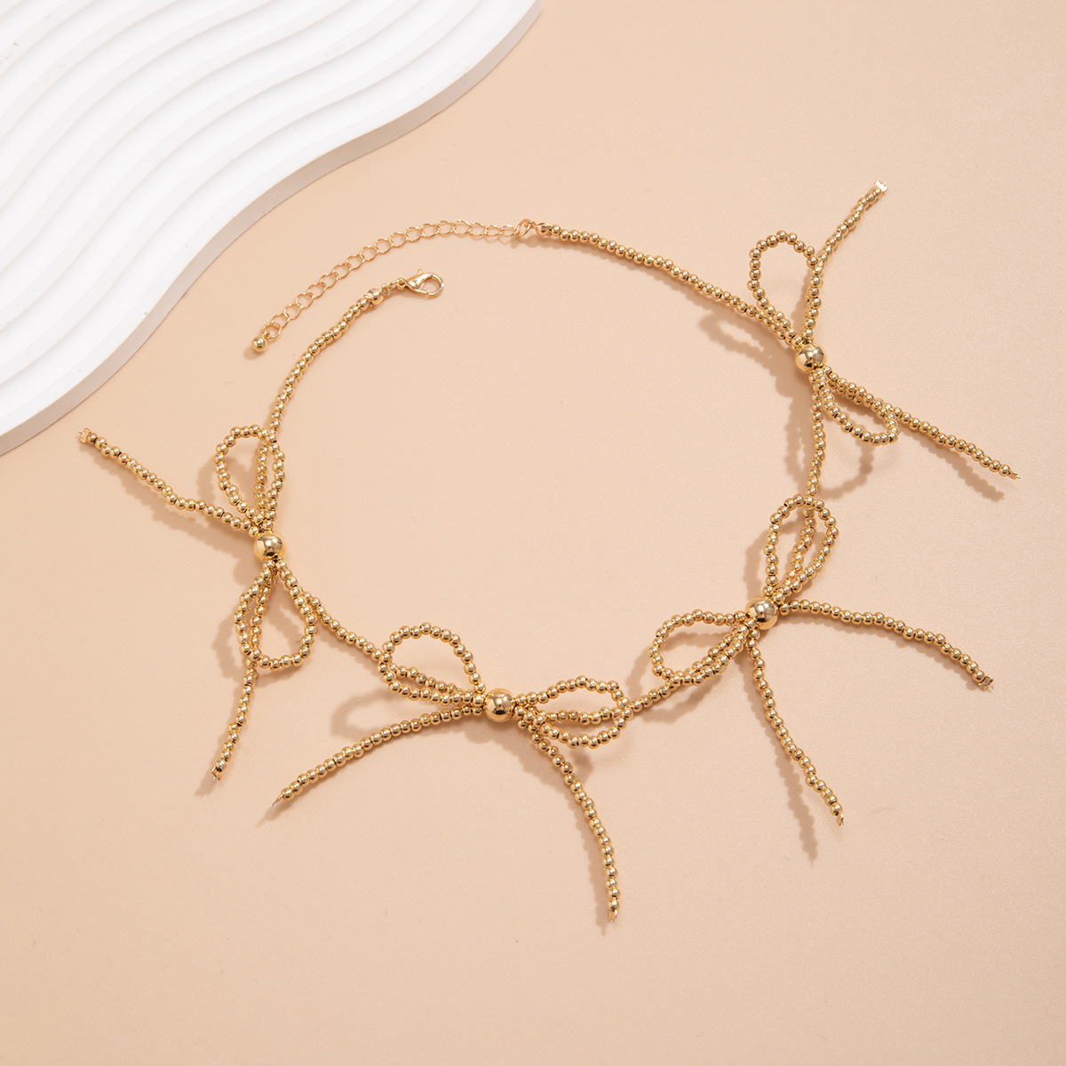 A popular cross-border bestseller in Europe and America, the BowEarring bow necklace, a niche tassel beaded and sweet and cool necklace Application Scenario
