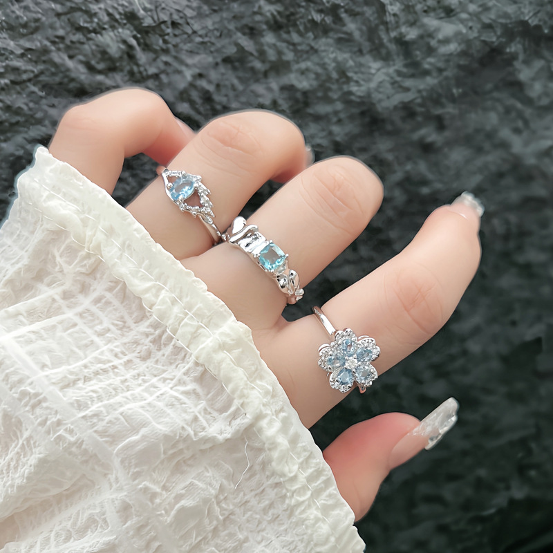 Korean version exquisite ice blue full diamond flower fashion ring, a cold and elegant female style, light luxury and high-end, sweet and cool stacked food ring details Picture