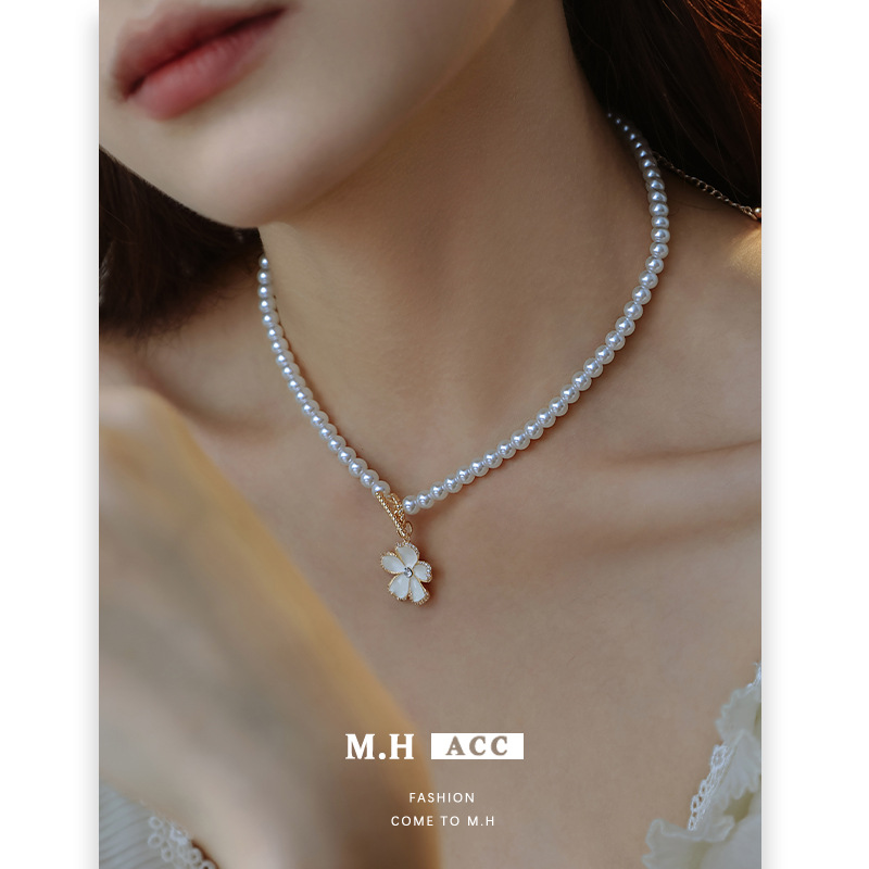 White oil-dripping flower OT necklace, French high-end female pearl sweater chain, niche exquisite wholesale necklace Application Scenario