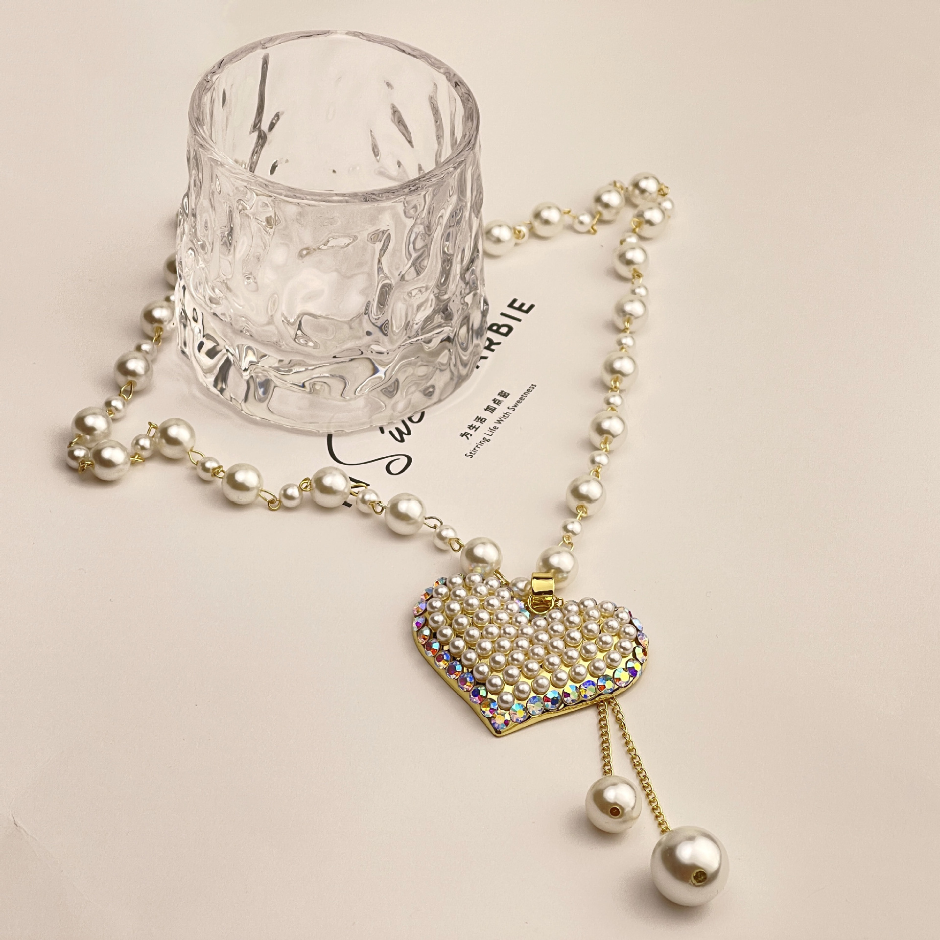 Wholesale of new tassel pearl heart-shaped necklace with a fashionable and individualistic touch, long pearl sweater chain pendant Application Scenario
