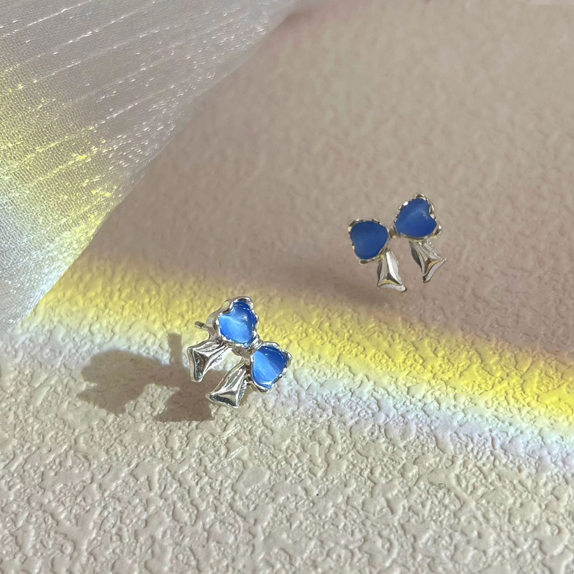 Mini, fresh and cute blue cat's eye stone bow stud earrings for women 2025 new bestsellers, fashionable and versatile earrings Application Scenario