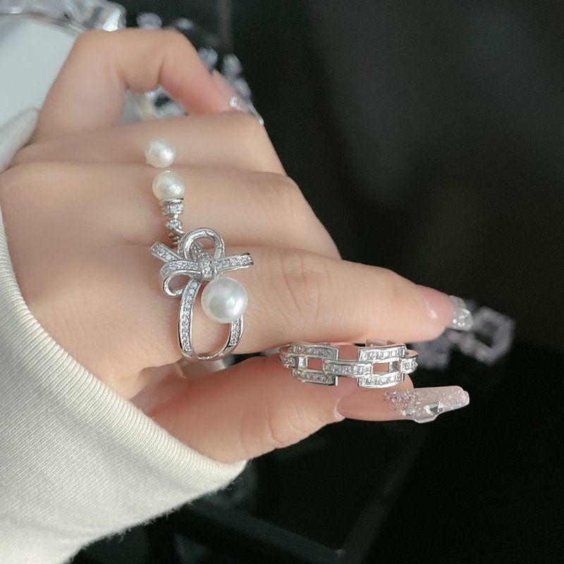 A light luxury and high-end bow pearl open ring for women on Instagram, a cold style, a niche sweet and cool temperament, and a trendy food ring trend details Picture