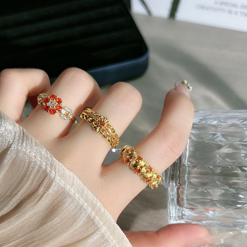 A simple open ring set with orange-red zircon in a mid-style style, featuring a retro brushed flower and a hollowed-out design, exuding a unique and elegant charm full figure