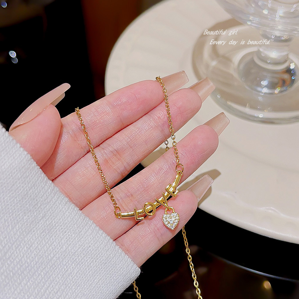 A niche heart-shaped LOVE letter necklace, a fashionable and elegant titanium steel collarbone chain by a female Internet celebrity on Instagram, and a unique cross-border accessory details Picture