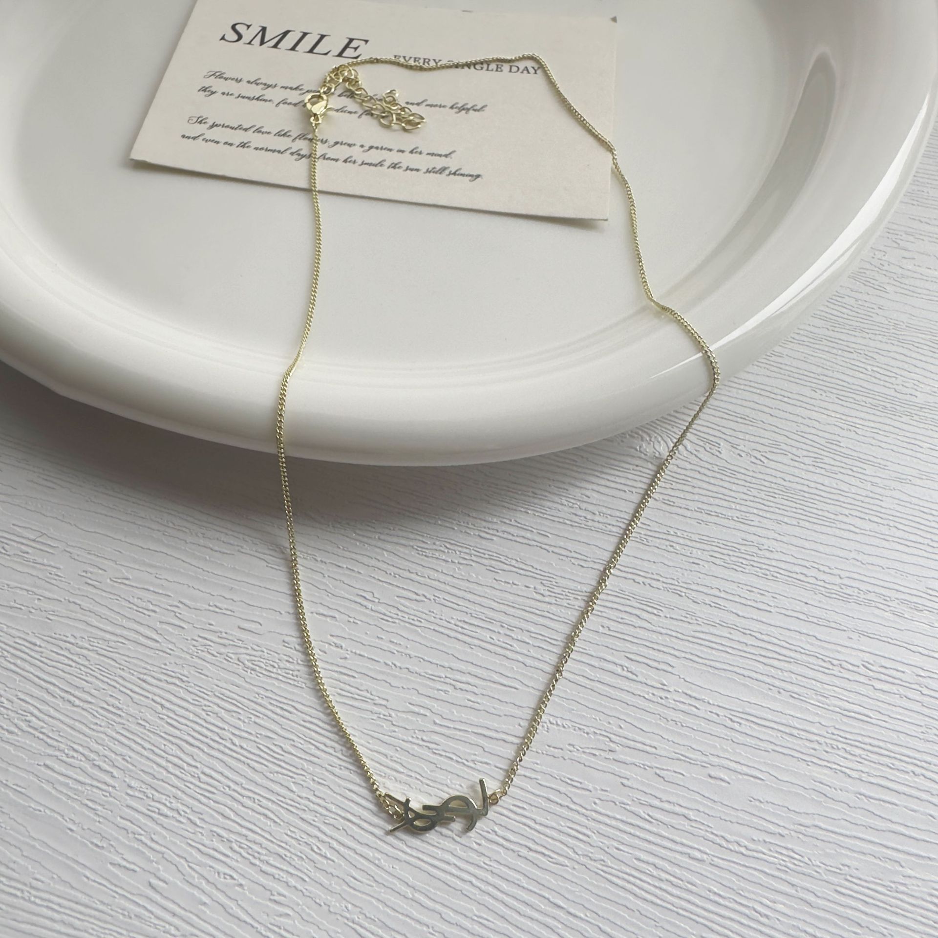 The new letter non-fading necklace features a unique design for women. It is a simple and elegant letter necklace with a layered collarbone chain full figure